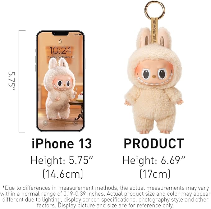 Cream‑colored Labubu blind‑box keychain from POP MART’s “Tasty Macarons” series, standing approximately 17 cm tall—visually compared next to an iPhone 13 for scale—featuring plush bunny‑ears onesie, glossy vinyl face with wide eyes and toothy grin, and attached gold-tone metal ring.”