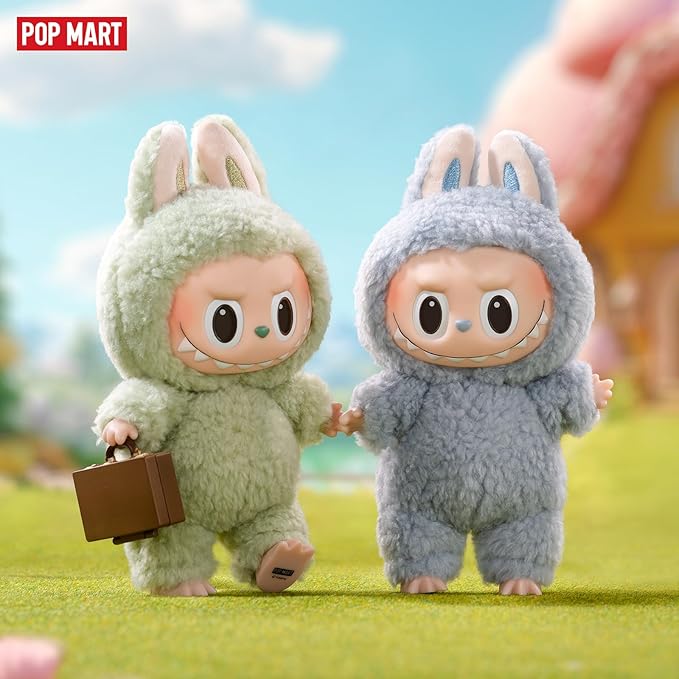POP MART The Monsters Tasty Macarons figures in pastel plush suits walking hand-in-hand with suitcase outdoors.