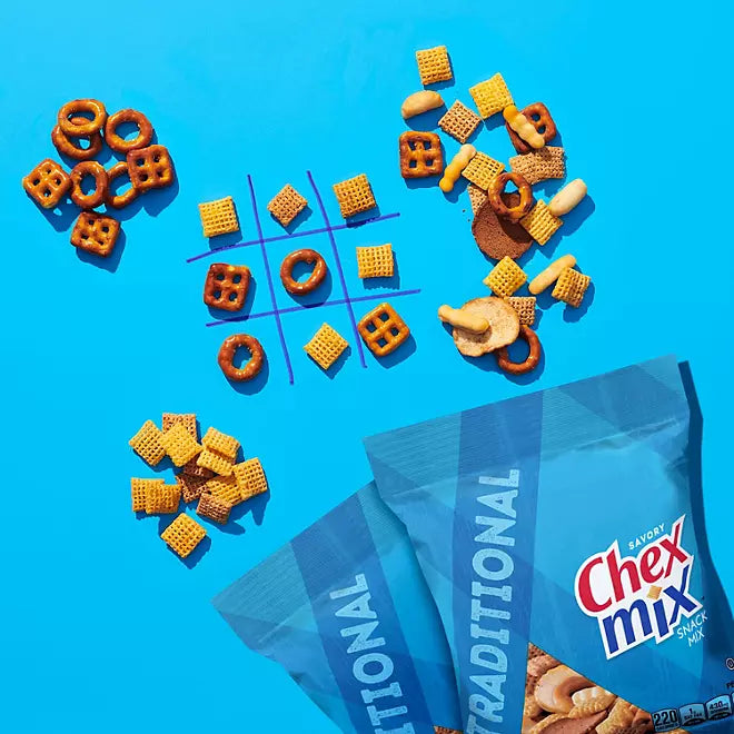 Chex Mix Traditional snack pieces arranged playfully on a bright blue background