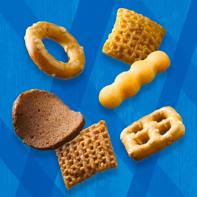 Close-up of Chex Mix Traditional pieces on blue textured background