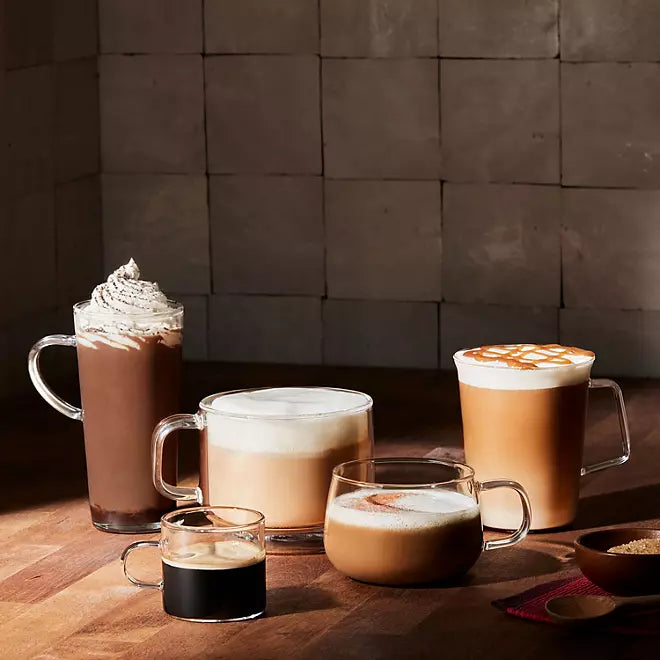 Variety of brewed coffee drinks including espresso, latte, cappuccino, and mocha on wooden surface

