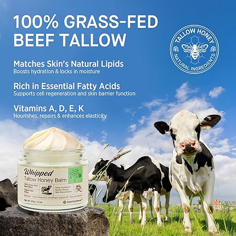 Whipped tallow honey balm jar displayed in a pasture with grass-fed cows, highlighting benefits of beef tallow like hydration, fatty acids, and skin-nourishing vitamins.

