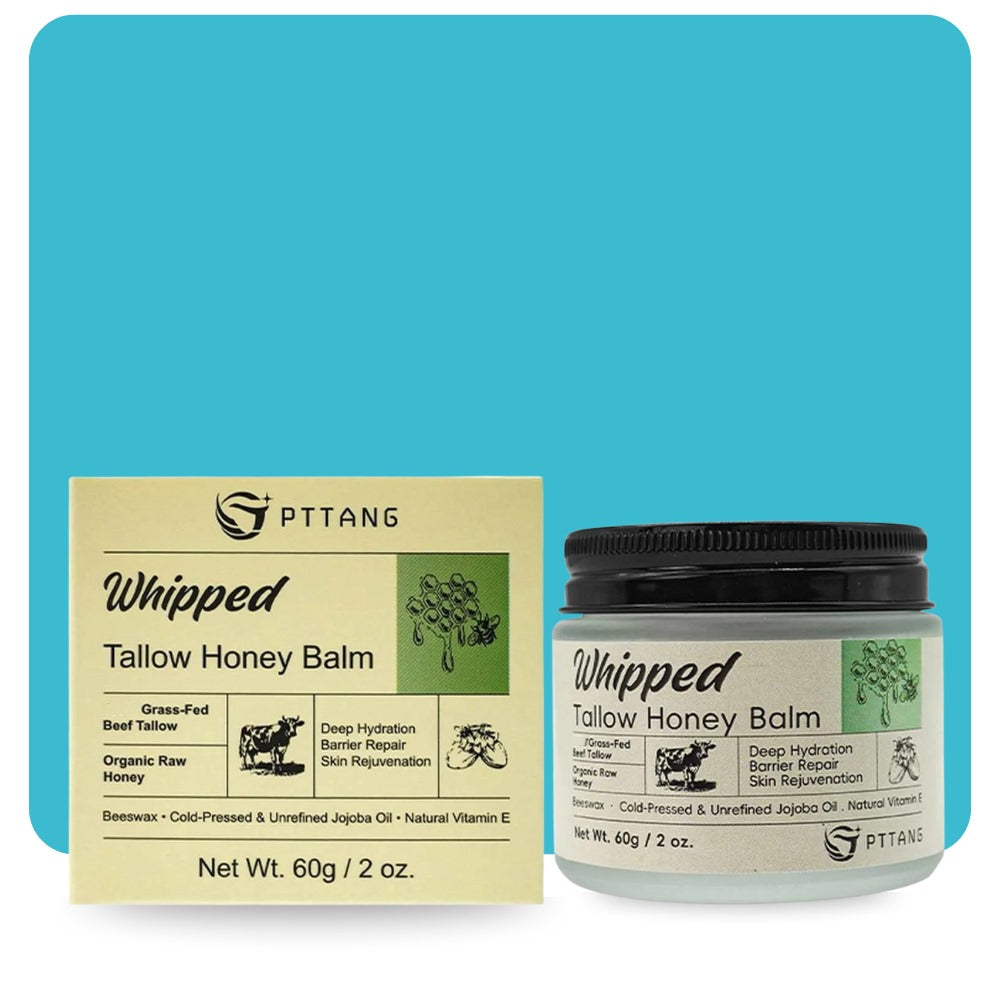 Front view of whipped tallow honey balm jar with product box showcasing ingredients like grass-fed beef tallow, raw honey, and jojoba oil.

